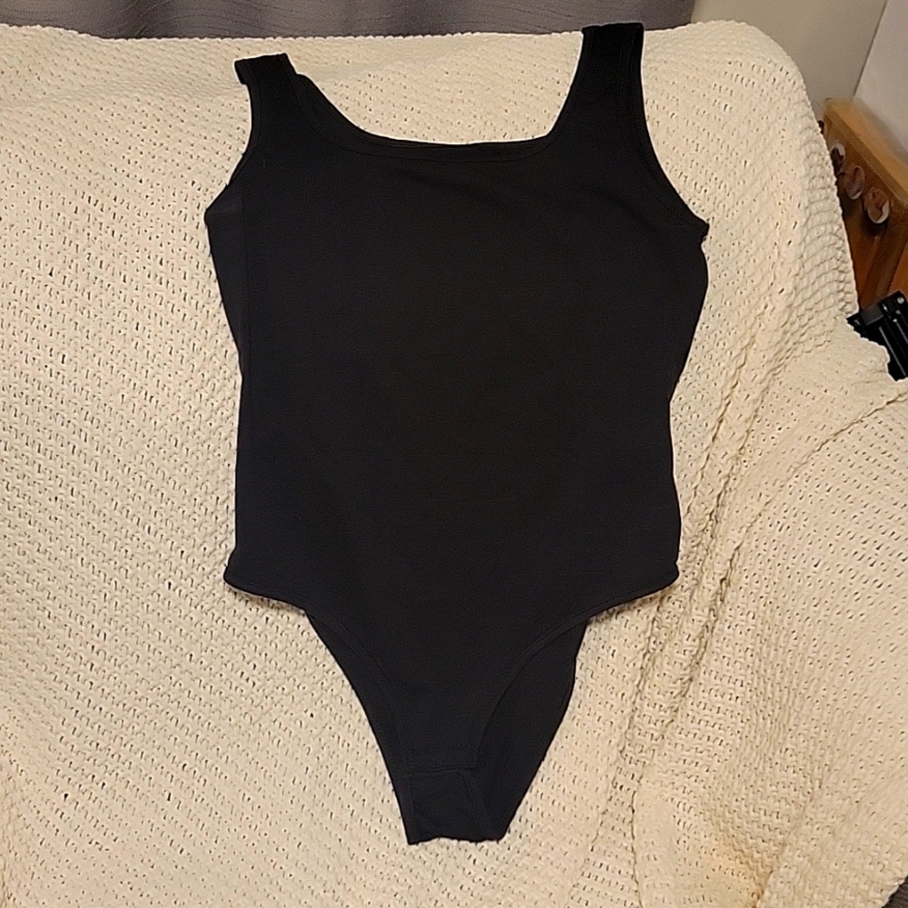 Black scoop neck bodysuit this shirt can be yours 4 free if you make a purchase